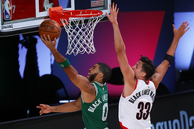 Boston Celtics' Jayson Tatum (0) goes up to shoot against Portland Trail Blazers' Zach Collins (33) during an NBA basketball game Sunday, Aug. 2, 2020, in Lake Buena Vista, Fla. (Mike Ehrmann/Pool Photo via AP) Boston Celtics' Jayson Tatum (0) goes up to shoot against Portland Trail Blazers' Zach Collins (33) during an NBA basketball game Sunday, Aug. 2, 2020, in Lake Buena Vista, Fla. (Mike Ehrmann/Pool Photo via AP)