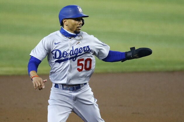 Los Angeles Dodgers' Mookie Betts takes a lead off of second base against the Arizona Diamondbacks during the first inning of a baseball game Saturday, Aug. 1, 2020, in Phoenix. (AP Photo/Ross D. Franklin)