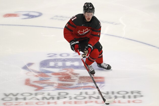 Canada's Alexis Lafreniere controls the puck during the U20 Ice Hockey Worlds match between Canada and the United States in Ostrava, Czech Republic, Thursday, Dec. 26, 2019. (AP Photo/Petr David Josek) Canada's Alexis Lafreniere controls the puck during the U20 Ice Hockey Worlds match between Canada and the United States in Ostrava, Czech Republic, Thursday, Dec. 26, 2019. (AP Photo/Petr David Josek)