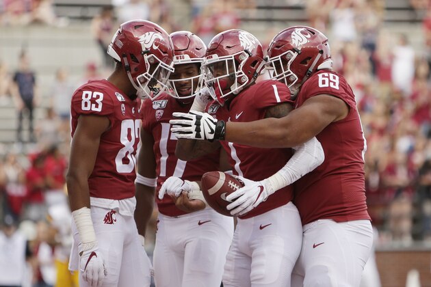 Washington State wide receiver Davontavean Martin (1) celebrates his touchdown with teammates Brandon Gray (83), Kassidy Woods (17) and Frederick Mauigoa (69) during the second half of an NCAA college football game against Northern Colorado in Pullman, Wash., Saturday, Sept. 7, 2019. (AP Photo/Young Kwak)
