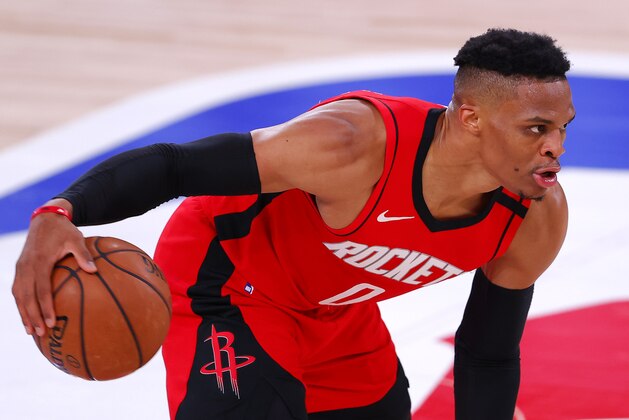 Houston Rockets' Russell Westbrook moves the ball against the Milwaukee Bucks during an NBA basketball game Sunday, Aug. 2, 2020, in Lake Buena Vista, Fla. (Mike Ehrmann/Pool Photo via AP) Houston Rockets' Russell Westbrook moves the ball against the Milwaukee Bucks during an NBA basketball game Sunday, Aug. 2, 2020, in Lake Buena Vista, Fla. (Mike Ehrmann/Pool Photo via AP)