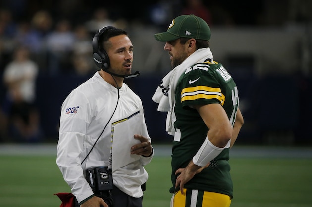 Green Bay Packers head coach Matt LaFleur talks with quarterback Aaron Rodgers, right, in the second half of an NFL football game against the Dallas Cowboys in Arlington, Texas, Sunday, Oct. 6, 2019. (AP Photo/Michael Ainsworth)