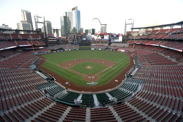 Empty seats are seen in this general view of Busch Stadium as St. Louis Cardinals starting pitcher Jack Flaherty throws the first pitch in baseball game against the Pittsburgh Pirates Friday, July 24, 2020, in St. Louis. (AP Photo/Jeff Roberson)