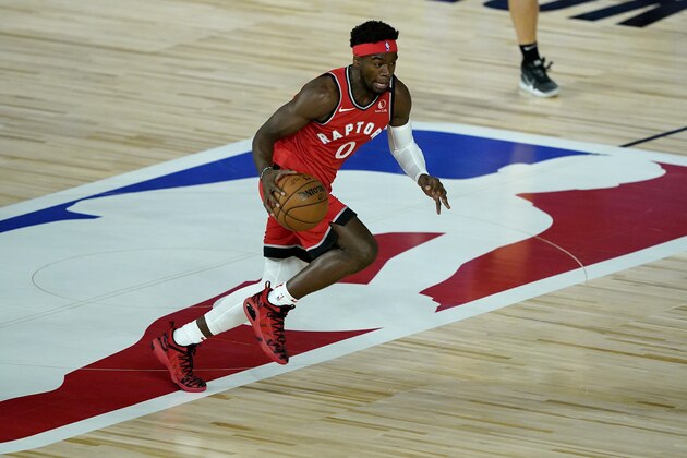 Toronto Raptors' Terence Davis (0) moves the ball up court against the Miami Heat during the first half of an NBA basketball game Monday, Aug. 3, 2020, in Lake Buena Vista, Fla. (AP Photo/Ashley Landis, Pool)