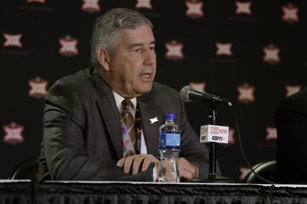 Big 12 commissioner Bob Bowlsby talks to the media after canceling the remaining NCAA college basketball games in the Big 12 Conference tournament due to concerns about the coronavirus Thursday, March 12, 2020, in Kansas City, Mo. The biggest conferences in college sports all canceled their basketball tournaments because of the new coronavirus, seemingly putting the NCAA Tournament in doubt. (AP Photo/Charlie Riedel)