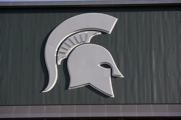 Michigan State's logo is seen on Spartan Stadium before the start of an NCAA college football game between Michigan State and Tulsa, Friday, Aug. 30, 2019, in East Lansing, Mich. (AP Photo/Al Goldis) Michigan State's logo is seen on Spartan Stadium before the start of an NCAA college football game between Michigan State and Tulsa, Friday, Aug. 30, 2019, in East Lansing, Mich. (AP Photo/Al Goldis)