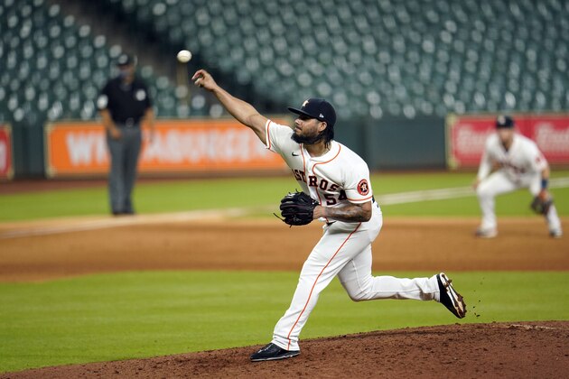 Houston Astros relief pitcher Roberto Osuna throws during the ninth inning of a baseball game against the Los Angeles Dodgers Wednesday, July 29, 2020, in Houston. (AP Photo/David J. Phillip) Houston Astros relief pitcher Roberto Osuna throws during the ninth inning of a baseball game against the Los Angeles Dodgers Wednesday, July 29, 2020, in Houston. (AP Photo/David J. Phillip)