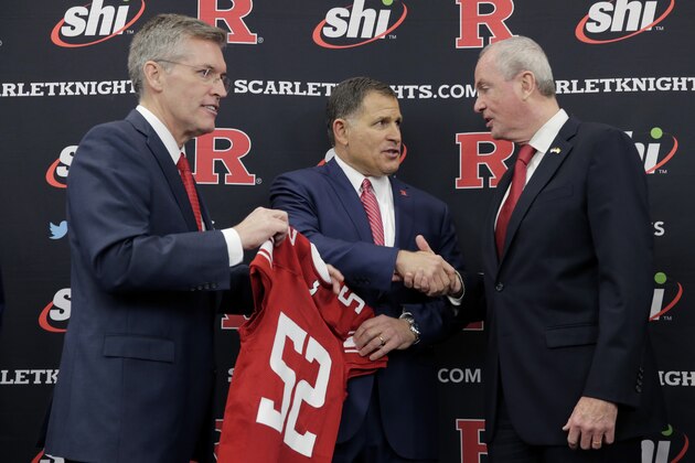 New Rutgers NCAA college football coach Greg Schiano, center, talks with New Jersey Gov. Phil Murphy, right, and Rutgers athletic director Pat Hobbs after an introductory news conference in Piscataway, N.J., Wednesday, Dec. 4, 2019. After an on-again, off-again courtship, Schiano is back as Rutgers football coach. (AP Photo/Seth Wenig)