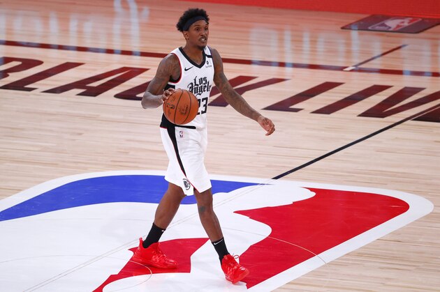 Los Angeles Clippers' Lou Williams dribbles against the Phoenix Suns during an NBA basketball game Tuesday, Aug. 4, 2020, in Lake Buena Vista, Fla. (Kevin C. Cox/Pool Photo via AP)