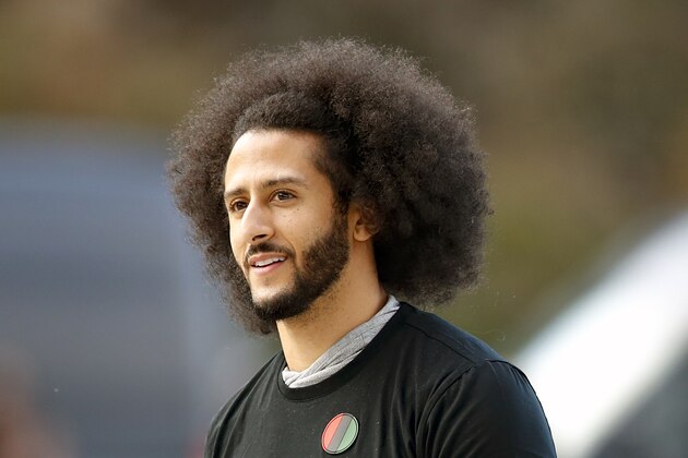 FILE - In this Nov. 16, 2019, file photo, free agent quarterback Colin Kaepernick arrives for a workout for NFL football scouts and media in Riverdale, Ga. The U.S. Navy is investigating a video in which military work dogs attacked a