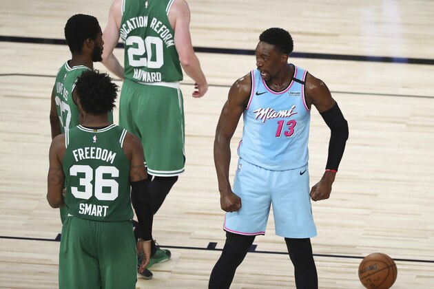 Miami Heat forward Bam Adebayo (13) reacts after scoring and getting fouled against the Boston Celtics during the second half of an NBA basketball game Tuesday, Aug. 4, 2020, in Lake Buena Vista, Fla. (Kim Klement/Pool Photo via AP)