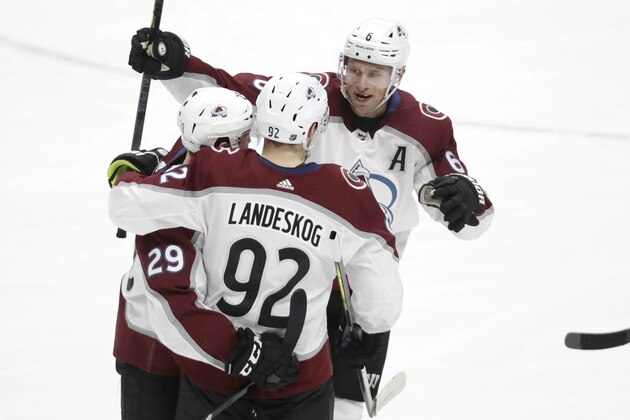 Colorado Avalanche left wing Gabriel Landeskog (92), of Sweden, celebrates with Nathan MacKinnon (29) and Erik Johnson (6) after Landeskog scored a goal against the Nashville Predators in the second period of an NHL hockey game Saturday, Feb. 29, 2020, in Nashville, Tenn. (AP Photo/Mark Humphrey)
