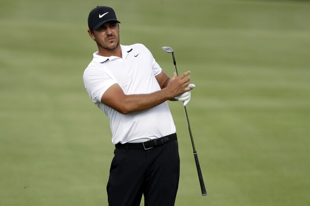 FILE - In this Sunday, Aug. 2, 2020, file photo, Brooks Koepka hits from the fairway during the final round of the World Golf Championship-FedEx St. Jude Invitational in Memphis, Tenn. It was only five years ago that Brooks Koepka became eligible for all the majors. Since then, he might as well be known as “Big Game Brooks” because he seems to contend for all of them without winning many regular events. This figures to be the ultimate test for his reputation. (AP Photo/Mark Humphrey, File)