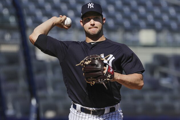 New York Yankees relief pitcher Tommy Kahnle throws a baseball during a baseball team workout Wednesday, Oct. 2, 2019, at Yankee Stadium in New York. Yankees will host the Minnesota Twins in the first game of an American League Division Series on Friday. (AP Photo/Frank Franklin II)