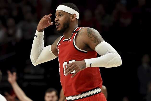 Portland Trail Blazers forward Carmelo Anthony reacts after making a shot during the second half of the team's NBA basketball game against the Phoenix Suns in Portland, Ore., Tuesday, March 10, 2020. The Blazers won 121-105. (AP Photo/Steve Dykes)