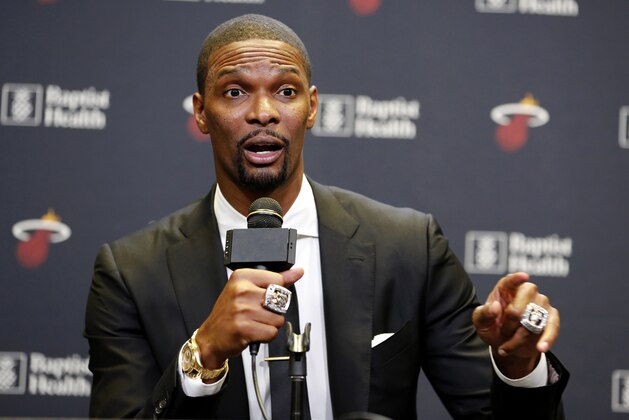 Former Miami Heat player Chris Bosh speaks at a press conference before the team's retirement of his jersey at halftime of an NBA game between the Heat and the Orlando Magic, Tuesday, March 26, 2019, in Miami. Bosh played 13 seasons, the first seven in Toronto and the last six in Miami. He averaged 19.2 points and 8.5 rebounds, was an All-Star 11 times and won two championships. (AP Photo/Joe Skipper)
