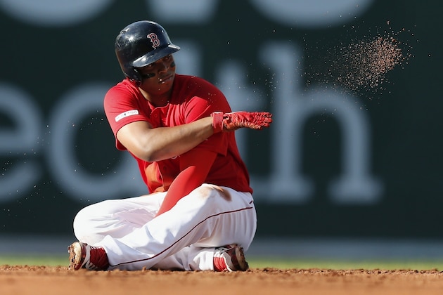 Boston Red Sox's Rafael Devers sits on second base after hitting a double during the third inning of a baseball game against the Baltimore Orioles in Boston, Sunday, Sept. 29, 2019. (AP Photo/Michael Dwyer)