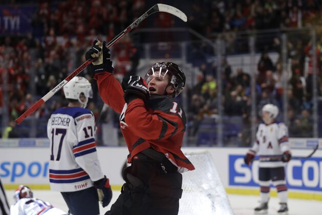 Canada's Alexis Lafreniere celebrates after scoring his sides fifth goal during the U20 Ice Hockey Worlds match between Canada and the United States in Ostrava, Czech Republic, Thursday, Dec. 26, 2019. (AP Photo/Petr David Josek)