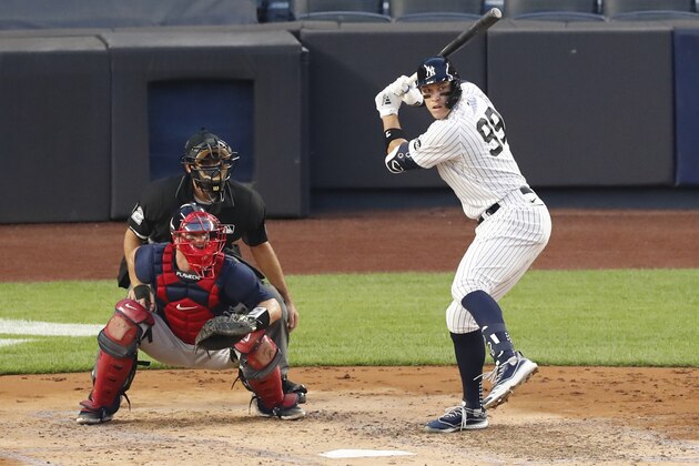 New York Yankees Aaron Judge sets up during an at-bat during the third inning of a baseball game against the Boston Red Sox, Sunday, Aug. 2, 2020, at Yankee Stadium in New York. Judge hit a three-run, home run in the at-bat. Red Sox catcher Kevin Plawecki (25) is behind the plate with home plate umpire James Hoye calling balls and strikes. (AP Photo/Kathy Willens) New York Yankees Aaron Judge sets up during an at-bat during the third inning of a baseball game against the Boston Red Sox, Sunday, Aug. 2, 2020, at Yankee Stadium in New York. Judge hit a three-run, home run in the at-bat. Red Sox catcher Kevin Plawecki (25) is behind the plate with home plate umpire James Hoye calling balls and strikes. (AP Photo/Kathy Willens)