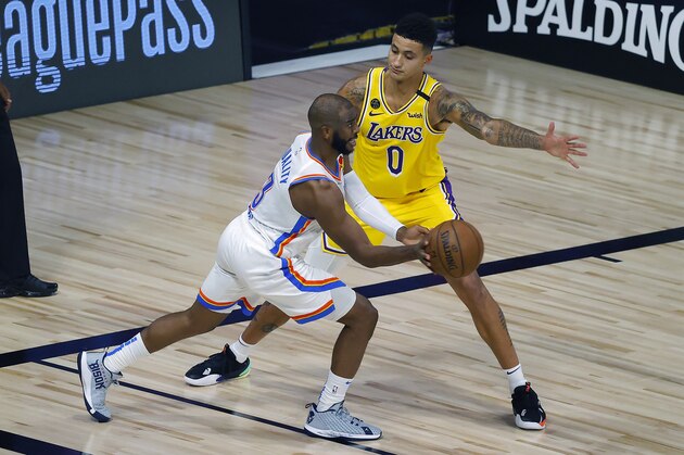 Kyle Kuzma, right, of the Los Angeles Lakers defends Chris Paul, left, of the Oklahoma City Thunder during the second half of an NBA basketball game Wednesday, Aug. 5, 2020, in Lake Buena Vista, Fla. (Kevin C. Cox/Pool Photo via AP)