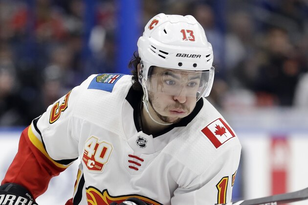 Calgary Flames left wing Johnny Gaudreau (13) against the Tampa Bay Lightning during the third period of an NHL hockey game Saturday, Feb. 29, 2020, in Tampa, Fla. (AP Photo/Chris O'Meara)