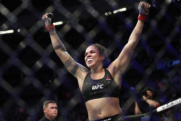 Amanda Nunes celebrates after defeating Germaine de Randamie in a mixed martial arts women's bantamweight championship bout at UFC 245, Saturday, Dec. 14, 2019, in Las Vegas. (AP Photo/John Locher)