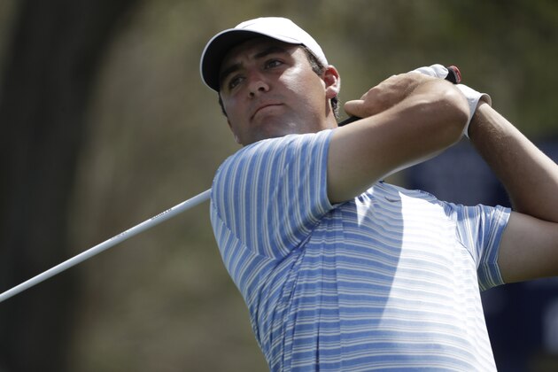 Scottie Scheffler hits from the ninth tee during the first round of The Players Championship golf tournament Thursday, March 12, 2020, in Ponte Vedra Beach, Fla. (AP Photo/Chris O'Meara)