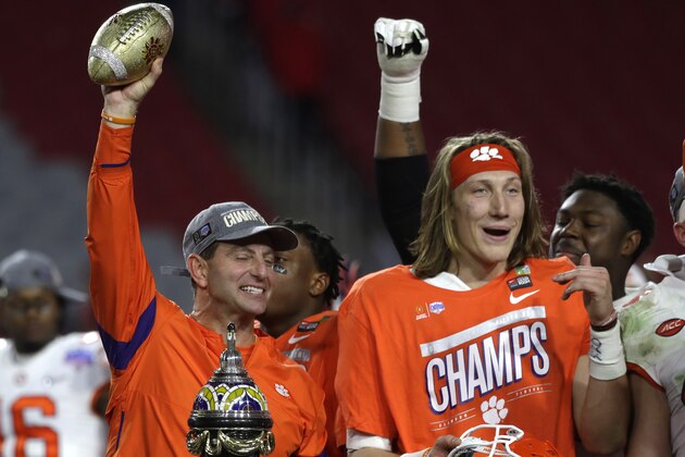 Clemson head coach Dabo Swinney and Trevor Lawrence (16) during the first half of the Fiesta Bowl NCAA college football game against Ohio State, Saturday, Dec. 28, 2019, in Glendale, Ariz. (AP Photo/Rick Scuteri).