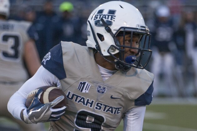 Utah State's Rayshad Lewis runs in the second half of an NCAA college football game against Nevada on Saturday, Nov. 19, 2016 in Reno, Nev. (AP Photo/Tom R. Smedes)