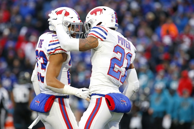 Buffalo Bills strong safety Micah Hyde (23) and free safety Jordan Poyer (21) react after a play against the Jacksonville Jaguars during the second half of an NFL football game, Sunday, Nov. 25, 2018, in Orchard Park, N.Y. (AP Photo/Jeffrey T. Barnes)