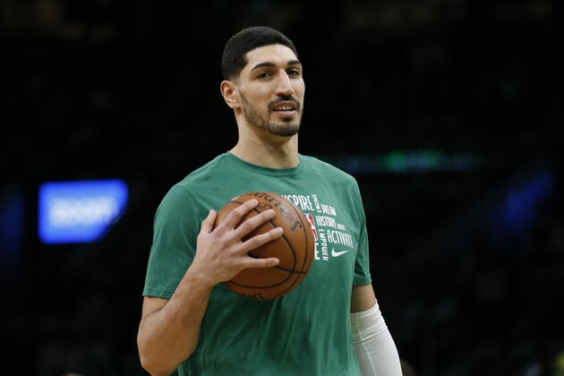 Boston Celtics center Enes Kanter holds a ball during warmups before the start of an NBA basketball game against the Atlanta Hawks, Friday, Feb. 7, 2020, in Boston. (AP Photo/Mary Schwalm)