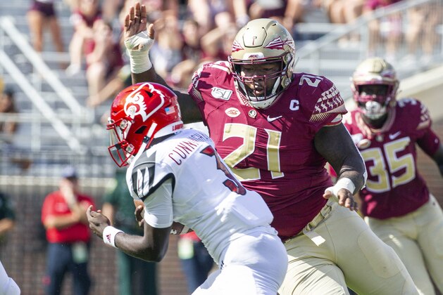 Florida State defensive tackle Marvin Wilson (21) moves in for the sack of Louisville quarterback Malik Cunningham (3) in the first half of an NCAA college football game in Tallahassee, Fla., Saturday, Sept. 21, 2019. (AP Photo/Mark Wallheiser)