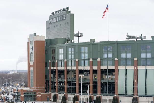 Fans tailgate before an NFL divisional playoff football game between the Green Bay Packers and the Seattle Seahawks Sunday, Jan. 12, 2020, in Green Bay, Wis. (AP Photo/Matt Ludtke)