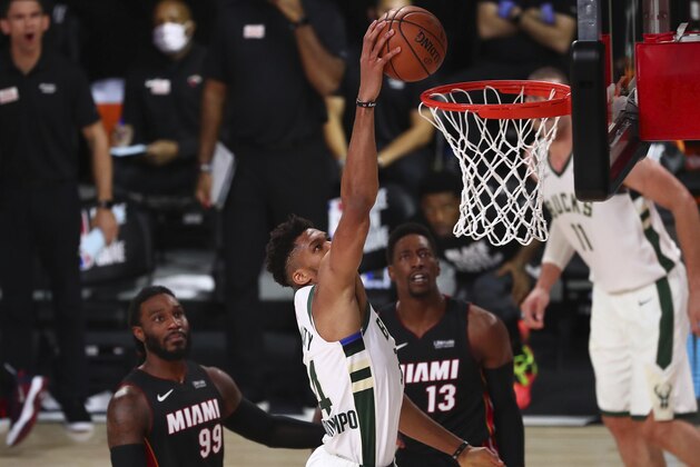 Milwaukee Bucks forward Giannis Antetokounmpo (34) moves in for a basket against the Miami Heat during the second half of an NBA basketball game Thursday, Aug. 6, 2020, in Lake Buena Vista, Fla. (Kim Klement/Pool Photo via AP)