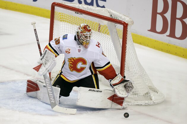 Calgary Flames goaltender Cam Talbot makes a save during the second period of an NHL hockey game against the Florida Panthers, Sunday, March 1, 2020, in Sunrise, Fla. (AP Photo/Wilfredo Lee)