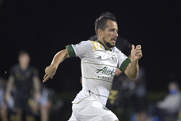 Portland Timbers midfielder Sebastian Blanco follows a play during the first half of an MLS soccer match against the Los Angeles FC, Thursday, July 23, 2020, in Kissimmee, Fla. (AP Photo/Phelan M. Ebenhack)