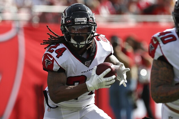 Atlanta Falcons running back Devonta Freeman (24) runs the ball against the Tampa Bay Buccaneers during an NFL football game Sunday, Dec. 29, 2019, in Tampa, Fla. The Falcons won the game 28-22 in overtime. (Jeff Haynes/AP Images for Panini)