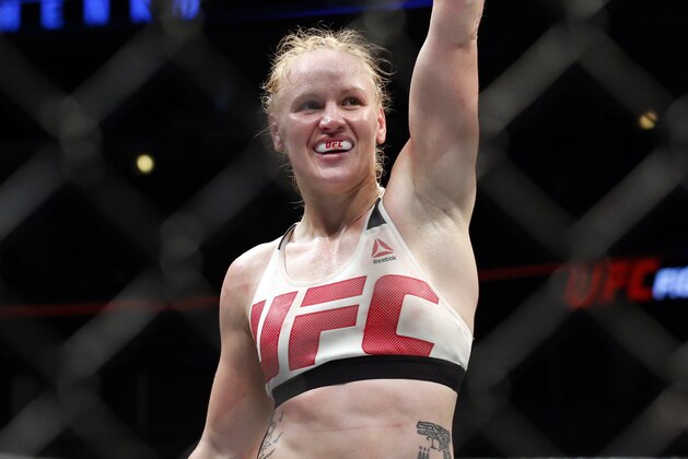 FILE - In this July 23, 2016, file photo, Valentina Shevchenko, of Kyrgyzstan, gestures after defeating Holly Holm during a women's bantamweight mixed martial arts bout at United Center in Chicago. Shevchenko is a Soviet-born Peruvian from Kyrgyzstan who does her mixed martial arts training in Thailand and the U.S. This avid traveler, dance contest winner and recent restaurant shooting survivor also might be the UFC's new bantamweight champion after her rematch with Amanda Nunes on Saturday, July 8, 2017. (AP Photo/Nam Y. Huh, File)