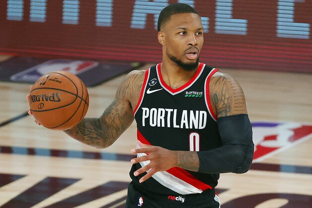 Portland Trail Blazers' Damian Lillard (0) dribbles during the second half of an NBA basketball game against the Houston Rockets Tuesday, Aug. 4, 2020, in Lake Buena Vista, Fla. (Kevin C. Cox/Pool Photo via AP)