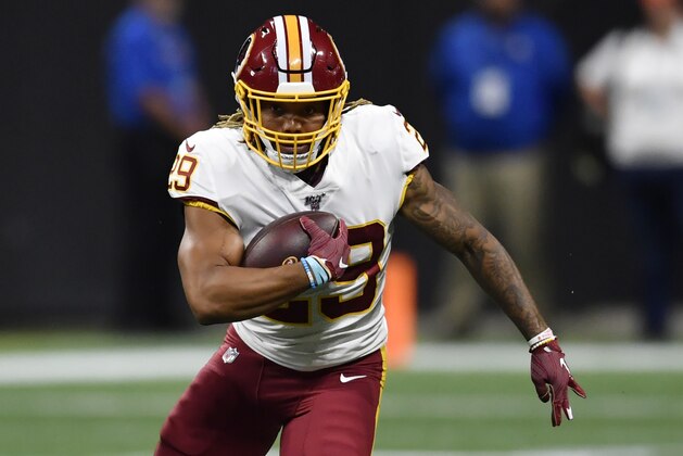 Washington Redskins running back Derrius Guice (29) runs against the Atlanta Falcons during the first half an NFL preseason football game, Thursday, Aug. 22, 2019, in Atlanta. (AP Photo/Mike Stewart)