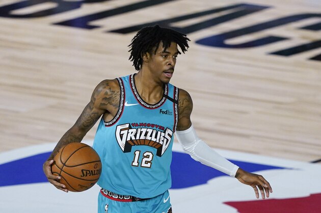 Memphis Grizzlies' Ja Morant (12) makes his way down the court during an NBA basketball game against the New Orleans Pelicans Monday, Aug. 3, 2020, in Lake Buena Vista, Fla. (AP Photo/Ashley Landis, Pool) Memphis Grizzlies' Ja Morant (12) makes his way down the court during an NBA basketball game against the New Orleans Pelicans Monday, Aug. 3, 2020, in Lake Buena Vista, Fla. (AP Photo/Ashley Landis, Pool)