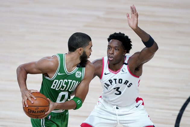 Boston Celtics' Jayson Tatum (0) works against Toronto Raptors' OG Anunoby (3) during the second half of an NBA basketball game Friday, Aug. 7, 2020 in Lake Buena Vista, Fla. (AP Photo/Ashley Landis, Pool)