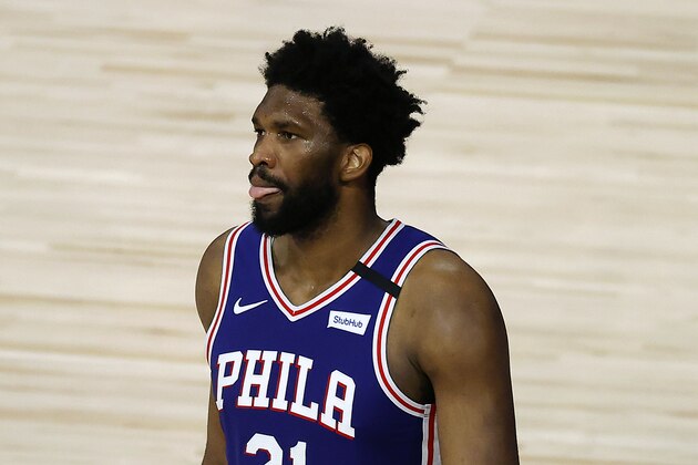 Philadelphia 76ers' Joel Embiid reacts after being charged with a foul during the third quarter of an NBA basketball game against the Orlando Magic, Friday, Aug. 7, 2020, in Lake Buena Vista, Fla. (Kevin C. Cox/Pool Photo via AP)