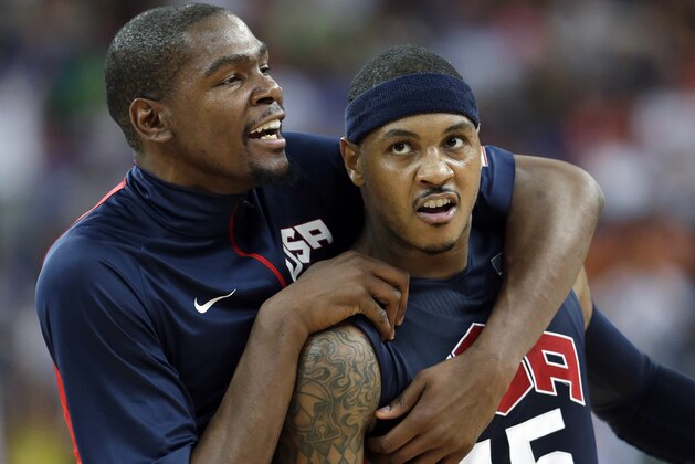 United States' Kevin Durant, left, celebrates with teammate Carmelo Anthony (15) after he scored during a semifinal men's basketball game against Argentina at the 2012 Summer Olympics, Friday, Aug. 10, 2012, in London. (AP Photo/Eric Gay)