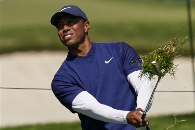 Tiger Woods hits from the rough on the seventh hole during the third round of the PGA Championship golf tournament at TPC Harding Park Saturday, Aug. 8, 2020, in San Francisco. (AP Photo/Jeff Chiu)