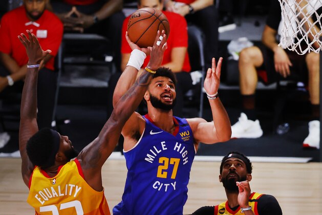 Denver Nuggets' Jamal Murray (27) drives the ball against Utah Jazz's Royce O'Neale and Mike Conley, right, during the second quarter of an NBA basketball game Saturday, Aug. 8, 2020, in Lake Buena Vista, Fla. (Kevin C. Cox/Pool Photo via AP)