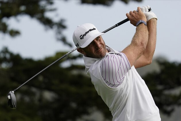 Dustin Johnson watches his tee shot on the 14th hole during the second round of the PGA Championship golf tournament at TPC Harding Park Friday, Aug. 7, 2020, in San Francisco. (AP Photo/Jeff Chiu)