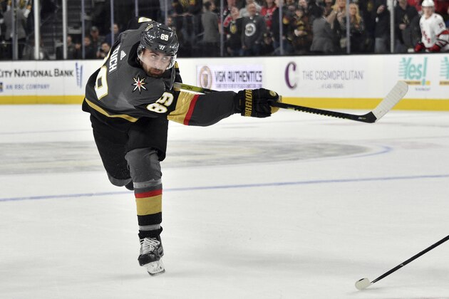 Vegas Golden Knights right wing Alex Tuch (89) takes a shot against the Carolina Hurricanes during overtime of an NHL hockey game Saturday, Feb. 8, 2020, in Las Vegas. (AP Photo/David Becker)