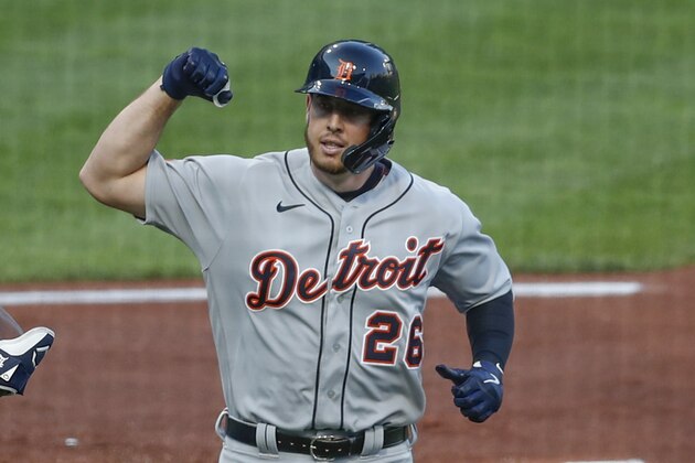 Detroit Tigers' C.J. Cron (26) celebrates as he scores against the Pittsburgh Pirates in a baseball game, Friday, Aug. 7, 2020, in Pittsburgh. (AP Photo/Keith Srakocic)