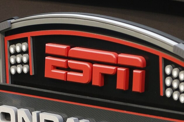 FILE - In this Sept. 16, 2013, file photo, an ESPN logo is seen prior to an NFL football game between the Cincinnati Bengals and the Pittsburgh Steelers in Cincinnati. The network will air the inaugural Overwatch League Grand Finals in prime time this month as part of a multiyear agreement to bring esports to the biggest sports platform on American television. Disney and Blizzard Entertainment announced plans Wednesday, July 11, 2018, to broadcast the OWL’s playoffs and championship on ESPN, ABC and Disney XD. The Grand Finals on July 27 and 28 will be shown live on ESPN, marking the first time the network will carry esports in prime time. (AP Photo/David Kohl, File)